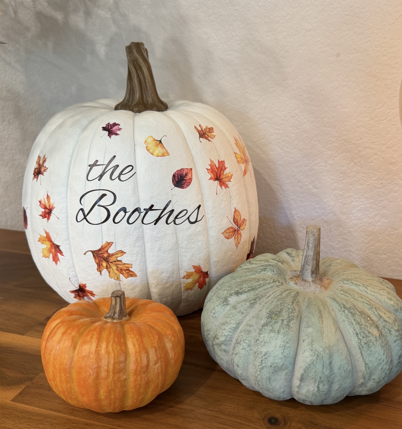 The Boothes personalized white pumpkin with colorful fall leaves